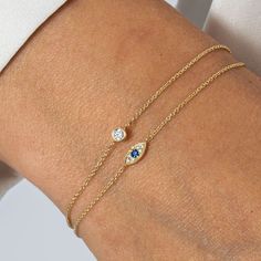 A beautifully crafted bracelet set in 14ct yellow gold, featuring a captivating deep blue sapphire evil eye charm. Designed to be both stylish and symbolic, this delicate piece radiates elegance while also serving as a protective talisman. Build those positive energy feels. Perfect for layering or wearing solo, this bracelet is more than just an accessory—it’s a statement of inner strength and harmony. 100% Recycled 14 Carat Solid Gold - Designed to last forever. Your jewellery will be more dura Blue Sapphire Bracelet, Solid Gold Bracelet, September Birthstone Jewelry, Blue Evil Eye, Sapphire Bracelet, The Evil Eye, Pearl Jewellery Earrings, Jewelry Ring Box, Solid Gold Jewelry