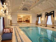 a large indoor swimming pool with chandelier