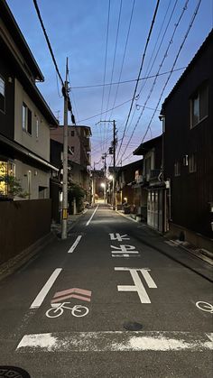 an empty street with bicycle lanes painted on it