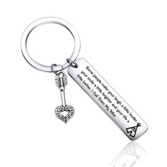 a keychain with a heart and an arrow on the front, is shown