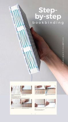 a hand holding an open book with instructions on how to fold the book in half