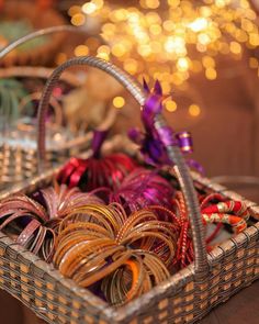 a basket filled with lots of different colored bracelets