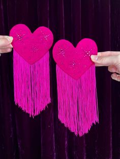 A pair of two heart shaped hair clips covered in HOT pink silk dupioni, hand embellished with coordinating hot pink rhinestones and matching 5" long chainette fringe  Comfortable and light- and the fringe adds a whole new level of eye-catching movement when you move! These have a rigid wired base with a slight curve to hug the side of the head. They can be gently bent to change the curvature to your liking.  Handmade by me from modern silk dupioni   Hearts measure 4.25" wide by 3.5" tall  Backed in matching satin with a 2.25" long alligator clip for secure attachment to hair  These are currently a one of a kind set, but if you'd like something similar, just send me a message! I can do the same style in other colorways. Heart Shaped Hair, Winter Rave, Welcome To The Circus, Showgirl Costume, Hot Pink Silk, Carnaval Costume, Hot Pink Hair, Pink Hair Clips, Silk Dupioni