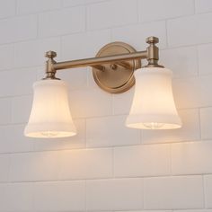 two light bathroom fixture with white glass shades