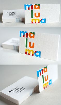 three different business cards with the word mau mau on one side and the letter mau mau on the other