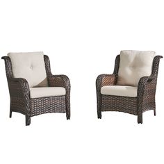 two wicker chairs sitting next to each other