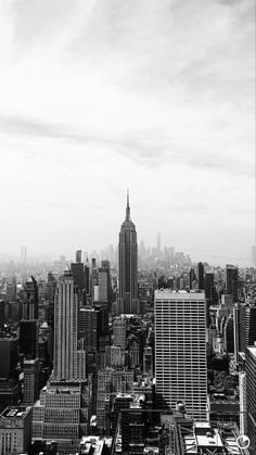 black and white photograph of city skyline with skyscrapers in new york, united states