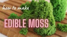 the words edible moss are displayed on a cutting board with some green plants in it