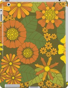 an orange and yellow flower pattern with green leaves