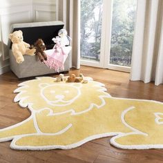 a child's room with teddy bears and rugs on the floor