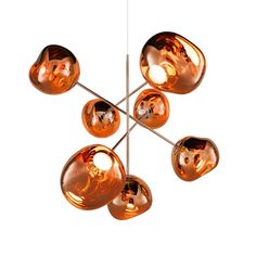 a modern chandelier with six glass balls hanging from the ceiling