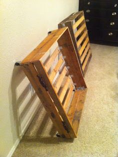 a wooden crate sitting on the floor next to a dresser