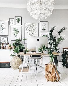 a living room filled with furniture and a fire place next to a wall mounted tv