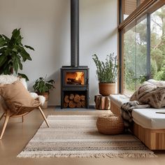 a living room filled with furniture and a wood burning stove in the middle of it