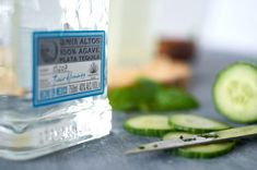 cucumber slices are next to a bottle of water