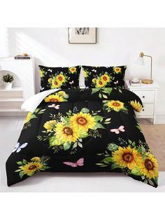 a bed with sunflowers and butterflies on it