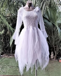 Make your occasion extra-special with one of our magical dresses.  *This beautiful fairy dress is made from high quality polyester body with three layers of soft tulle. *The dress has a stretch bodice to fit all sizes from 1XL up to 4XL. *Available in a large range of colours to choose from to suit your theme - from delicate pastels to deeper rich shades. *To add extra sparkle to the dress, it has scattered sequins sewn over the dress and beads at the hems.   A MATCHING GARLAND CAN BE PURCHASED White Fitted Fairycore Dress, Fitted White Fairy Kei Dress, Spring Fairy Dress For Costume Party, White Fitted Fairy Dress For Dress-up, White Fairy Kei Dress With Ruffles, Spring Fairy Style Tutu Dress With Tulle Skirt, Spring Princess Dress With Tulle For Costume Party, White Fitted Fairy Dress, Spring Princess Dress In Tulle For Costume Party