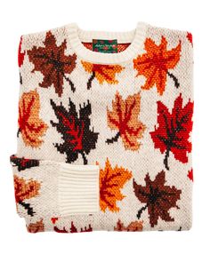 a sweater with autumn leaves on it