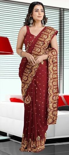 Red and Maroon color Saree in Georgette fabric with Stone work Bollywood Style Burgundy Traditional Wear For Wedding, Burgundy Traditional Wear For Wedding And Festivals, Burgundy Saree With Zari Work For Wedding, Burgundy Wedding Saree With Zari Work, Traditional Burgundy Wedding Wear, Festive Burgundy Dupatta For Wedding, Festive Burgundy Wedding Traditional Wear, Burgundy Traditional Wear With Resham Embroidery For Wedding, Elegant Burgundy Traditional Wear For Wedding