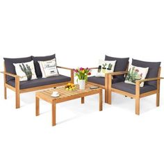 three pieces of wood furniture with cushions and pillows on the couches, coffee table and end tables