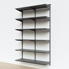 an empty shelving unit on a white wall