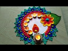 an artistically decorated diya with candles