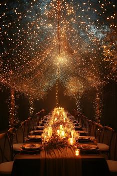 a long table with candles and lights on it