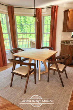 Light maple dining table with chevron shaped legs, in a dining room with dark wood chairs, a grey rug, and large windows in the background looking out on a tree-filled yard. The edge of kitchen cabinets can be seen on the right. The Loewen Design Studios logo is on the bottom of the photo in white. Square Dining Table Wood, Mid Century Modern Wood Furniture, Dining Room Natural, Square Wood Table, Bright Dining Room, Timeless Dining Room, Natural Dining Room, Bright Dining Rooms, Maple Dining Table