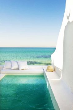 an instagramted photo of a pool with the ocean in the background