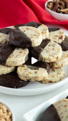 a white plate topped with cookies covered in chocolate