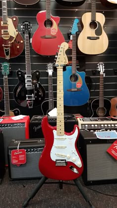 guitars and amps on display in a music store