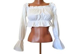 Off the shoulder long sleeve crop top in white Details - Cropped length, Bardot neck, Elasticated trims, Long sleeves Made of polyester Label size S /US 4/ US 36 Meassurements /flat/ - armpit to armpit 14''/36cm length 12''/30cm Excellent condition Fall Ruffled Crop Top, White Ruffled Long Sleeve Crop Top, White Long Sleeve Crop Top With Ruffles, Stretch Ruffled Long Sleeve Crop Top, Stretch Long Sleeve Crop Top With Ruffles, Long Sleeve Ruffled Crop Top, Crop Top Off Shoulder, Top Puff Sleeve, White Lace Shirt