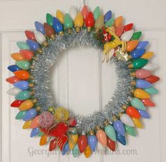 a wreath made out of plastic christmas ornaments