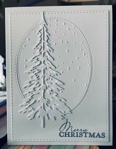 a white card with a christmas tree on it