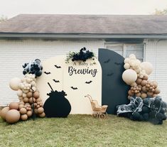 balloons and decorations are displayed in front of a house