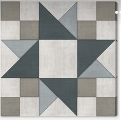 an image of a patchwork wallpaper with grey and white squares on the bottom