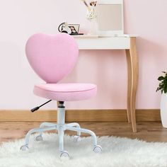 a pink office chair sitting on top of a white rug in front of a desk