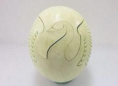 a white vase with an intricate design on it