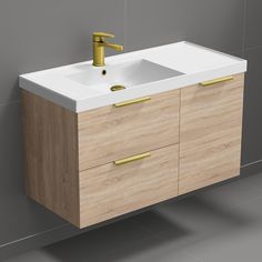 a bathroom sink sitting next to a wall mounted faucet on top of a wooden cabinet