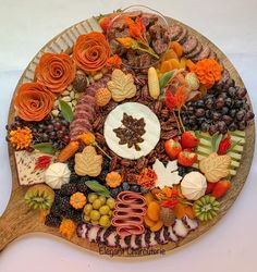 a wooden platter filled with lots of different types of food