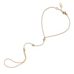 This hand chain features cubic zirconia stones in a bezel setting to add sparkle. Wear alone or pair with the matching ring for a beautiful and delicate look. Thick layer of 14K Gold over .925 Sterling Silver Cubic Zirconia pave crystals, 3mm Hypoallergenic, lead and nickel free Purchase the Handchain on its own or as a set with the Pave ring Wrist Length:6-6.75in(15-17cm), 7-7.5in(18-19cm) Crystal Length 2.5in(6.3cm) Handcrafted in NYC #B301 Hand Chain Bracelet, Matching Ring, Crystal Chain, Hand Chain, Matching Rings, Dainty Bracelets, Gold Bracelet Chain, Gold Hands, Hand Jewelry