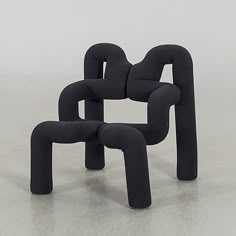 two black chairs sitting next to each other