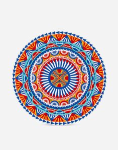 a colorful plate with an intricate design on the front and back side, in red, blue, orange and white colors