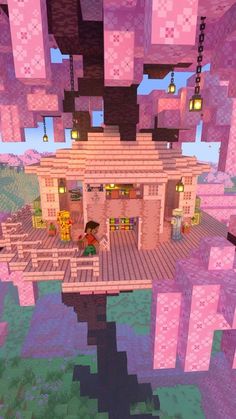 an image of a house in the middle of some pink blocks with lights on it