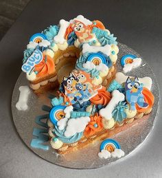 a cake with frosting and cartoon characters on it