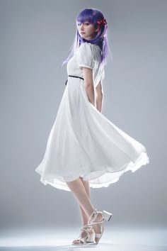 a woman with purple hair wearing a white dress