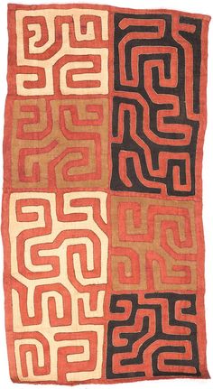 an orange and black rug with different designs on it