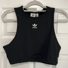 Nwt Adidas Tank Top. Black Ribbed Tank Top With White Embroidered Adidas Emblem On Front. Size Large. Small Cutout On Bottom. So Cute For Gym Or Every Day ! Brand New With All Tags Attached. Slightly Cropped Style Adidas Fitted Sleeveless Tank Top, Adidas Sleeveless Fitted Tank Top, Black Sports Crop Top For Spring, Fitted Sleeveless Adidas Tank Top, Adidas Cotton Tank Top For Spring, Adidas Casual Cotton Tank Top, Casual Adidas Cotton Tank Top, Black Stretch Adidas Tops, Adidas Trendy Fitted Tops