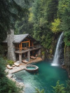 a house in the woods with a waterfall coming out of it's back yard