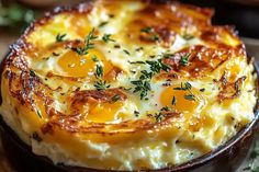 an egg and cheese casserole in a brown dish on a wooden table with parsley